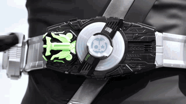 a person wearing a belt with a skull and a star on it