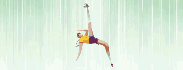 a man in a yellow shirt and blue shorts is jumping in the air