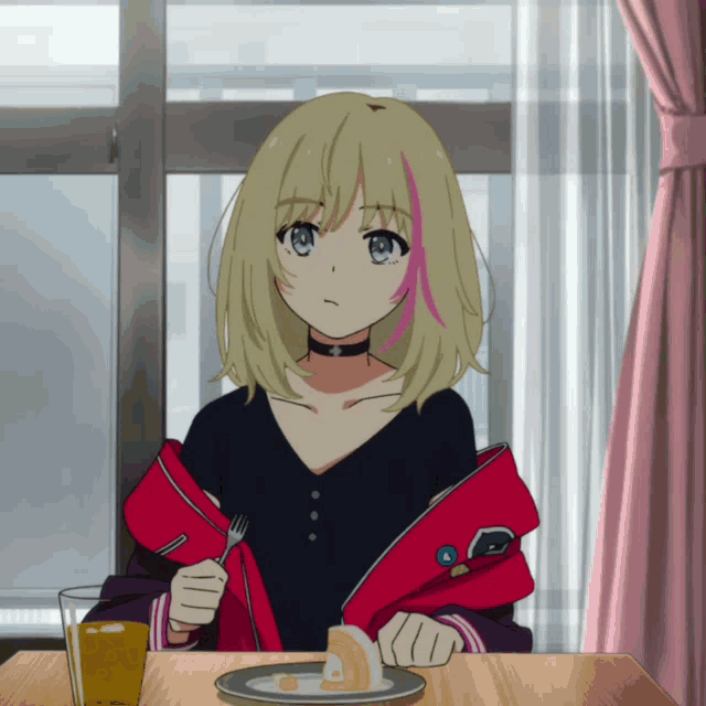a girl with blonde hair is sitting at a table with a plate of food