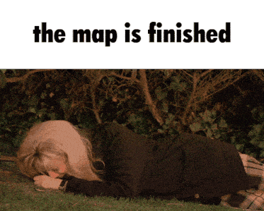 a woman laying on the grass with the words the map is finished below her