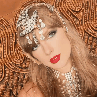 a close up of a woman wearing a headpiece