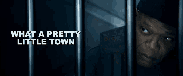 a man behind bars with the words " what a pretty little town " above him