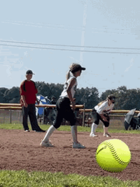 a girl in a white shirt with the number 28 on it