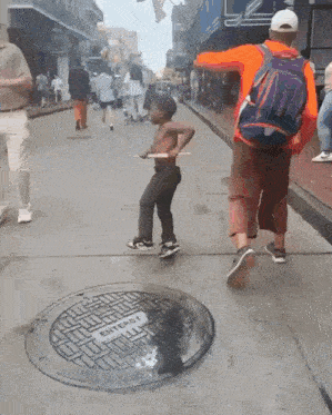 a manhole cover on the side of the road that says entry