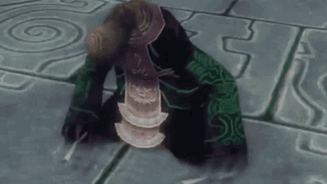 a video game character is kneeling on the ground with a swirl on the ground behind him .
