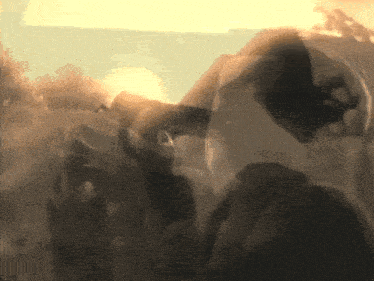 a blurred image of a person wearing a mask