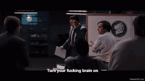 a group of men are gathered around a man who says turn your fucking brain on ..