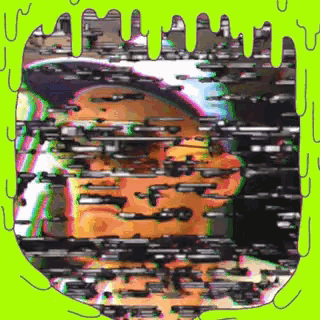 a glitch image of a person 's face with a green border around it