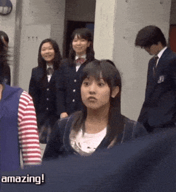 a group of people are standing in a hallway with the words amazing written on the bottom