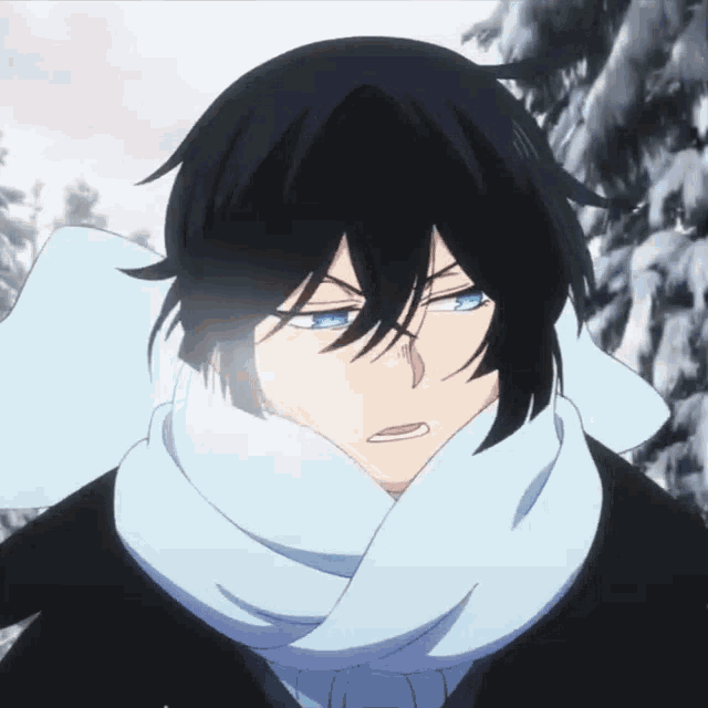 a man with black hair and blue eyes wearing a scarf around his neck