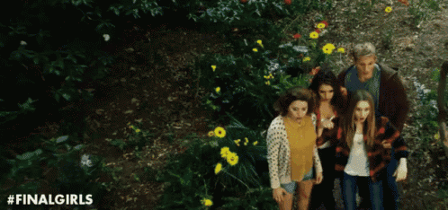 a group of people are walking through a field of flowers with the hashtag finalgirls on the bottom