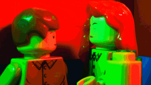 a man and a woman are standing next to each other and the man 's shirt says cw
