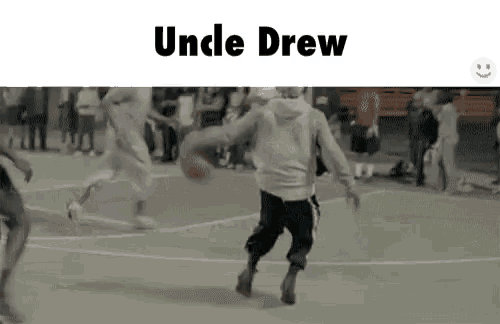 a group of people are playing basketball on a court with the words `` uncle drew '' on the bottom .