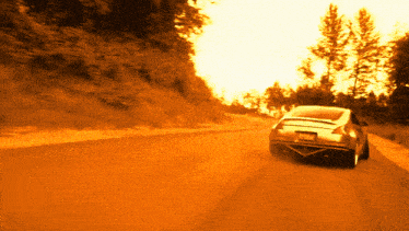 a car is driving down a dirt road with a license plate that says ' jc ' on it