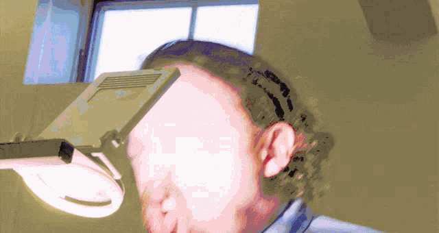 a man 's head is shown with a magnifying glass on top of it