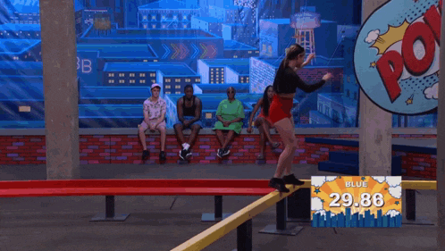a woman is jumping in front of a sign that says blue 31.19