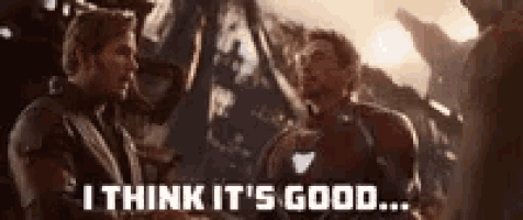 a couple of men standing next to each other and one of them is saying `` i think it 's good ... ''