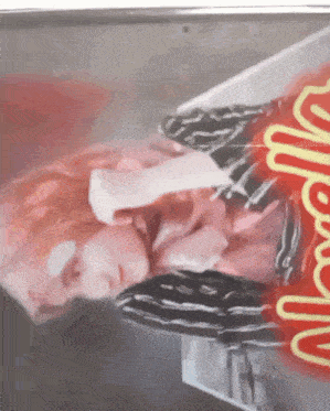 a painting of a woman with a bandage on her head and a neon sign that says nutella