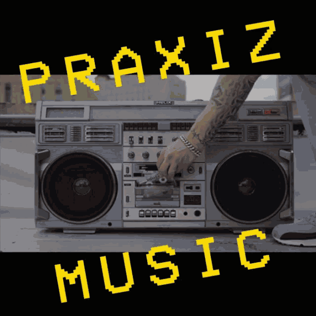 a man is putting a cassette tape into a boombox that says praxis music