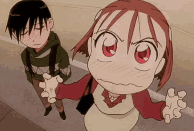 a boy and a girl standing next to each other