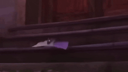 a man in a white shirt is walking down stairs .