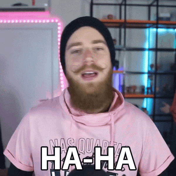 a man with a beard is wearing a pink shirt that says " ha-ha "