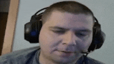 a man wearing headphones and a microphone is talking on a video call .