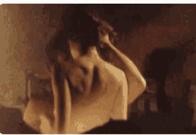 a man and a woman kissing in a blurry photo