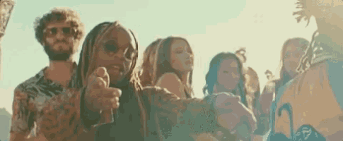 a group of people are standing next to each other .