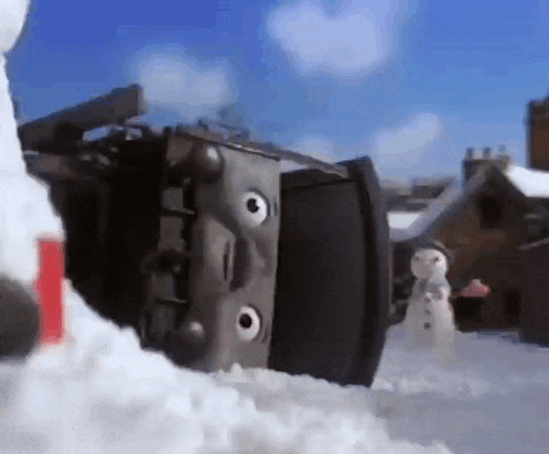 a snowman is standing next to a snow plow in the snow .