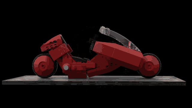 a model of a red motorcycle with a clear windshield