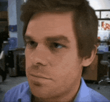 a close up of a man 's face with his eyes closed