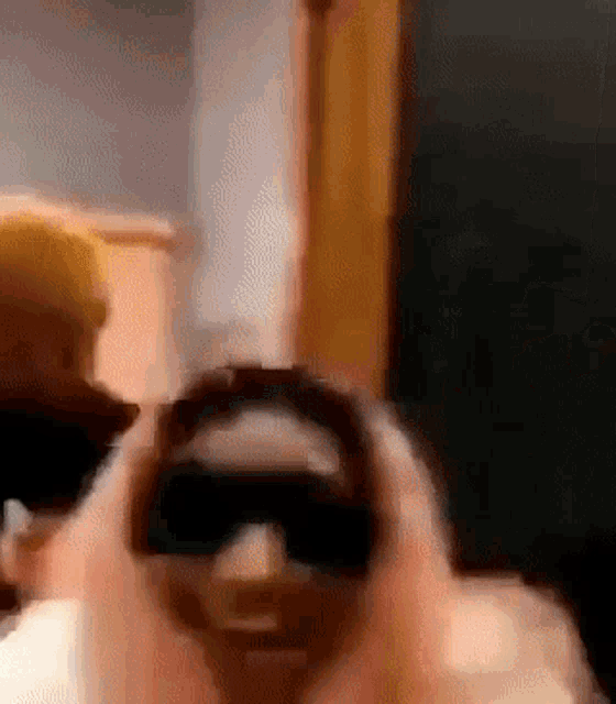 a person is taking a picture with a camera .