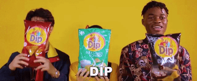 a group of people holding bags of dip chips in front of their faces