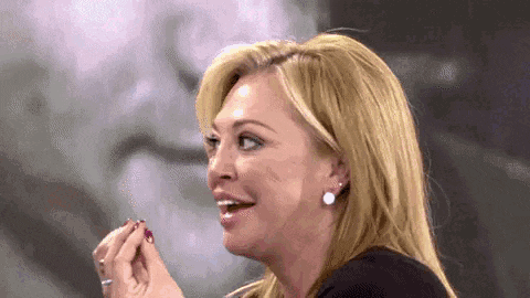 a close up of a woman 's face with a smile on her face