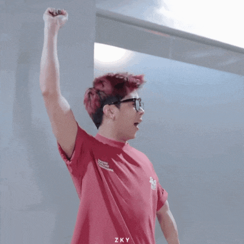 a man with red hair and glasses is wearing a red t-shirt that says mp on it