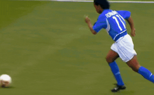 a soccer game is being played on a field with ads for adidas and mastercard in the background