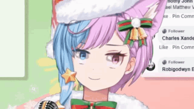 a close up of a girl wearing a santa hat and a bow tie