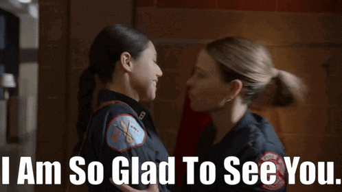 two female firefighters standing next to each other with the words " i am so glad to see you " below them