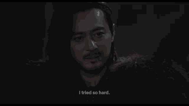 a man with long hair and a beard is saying " i tried so hard "
