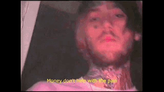 a close up of a man 's face with the words `` money don 't help with the pain '' written on the bottom .
