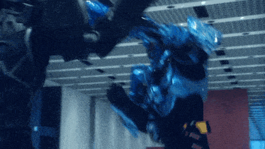 a blurry picture of a robot with the word fire on the wall