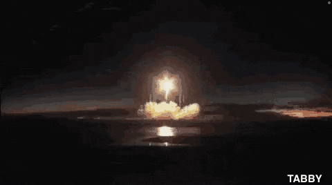 a close up of a rocket taking off in space .
