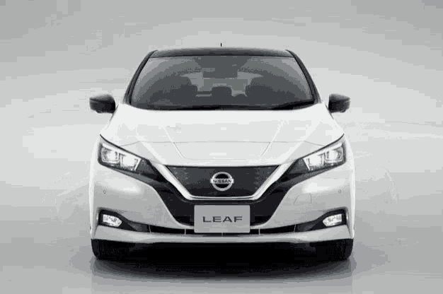 the front of a white nissan leaf with black trim