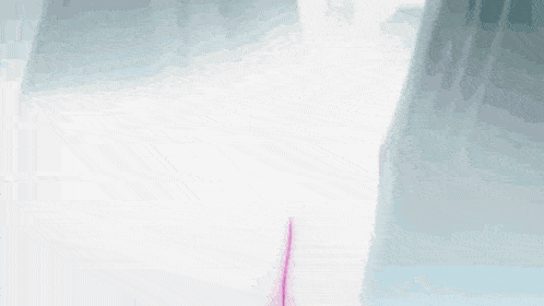 a blurred image of a person 's shadow on a white wall