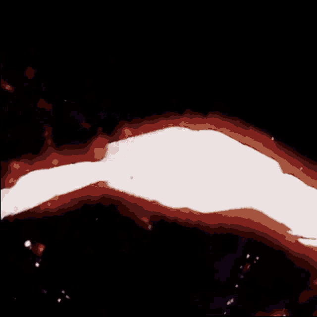 a close up of a red and white object with the letters s and t on it
