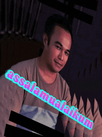 a man wearing a t-shirt that says assalamualaikum