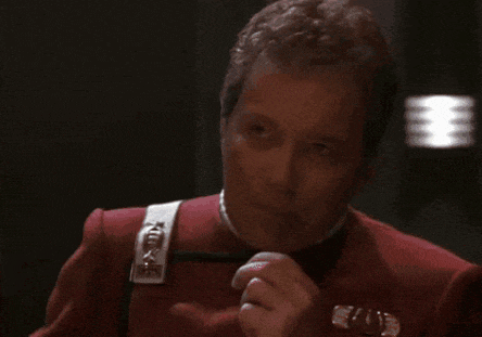 a man in a red uniform is covering his mouth