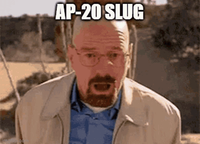 a man with a beard and glasses is making a funny face with his mouth open and the words `` ap-20 slug '' .