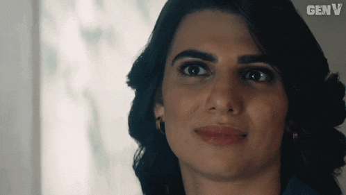 a close up of a woman 's face with genv written in the corner